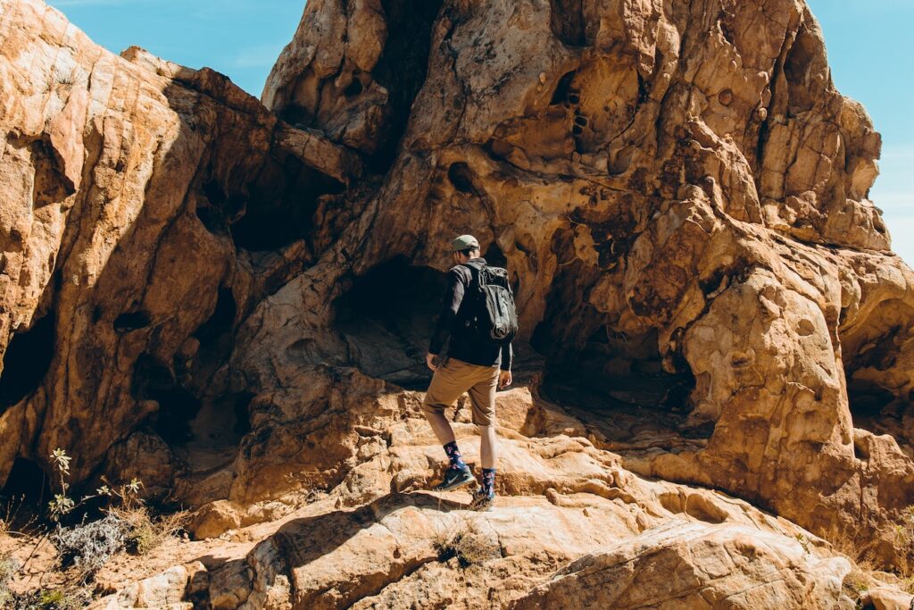 Man hiking through a rocky terrain
