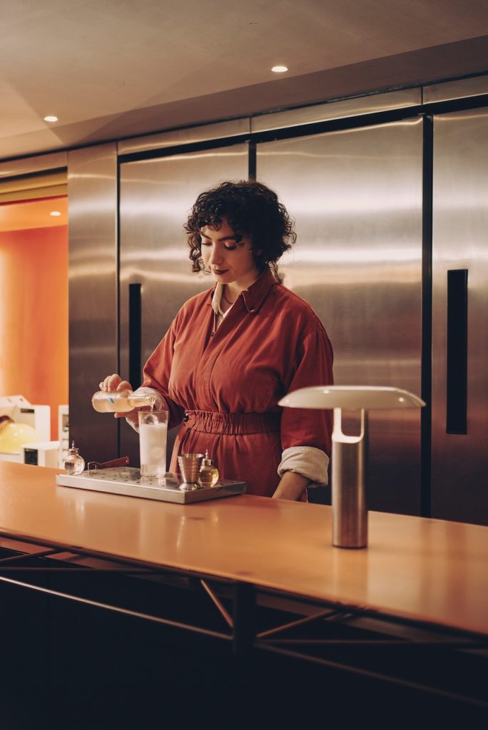 A server mixing a cocktail