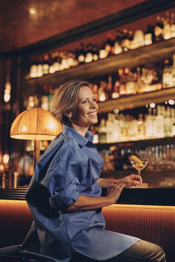 A woman drinking a cocktail