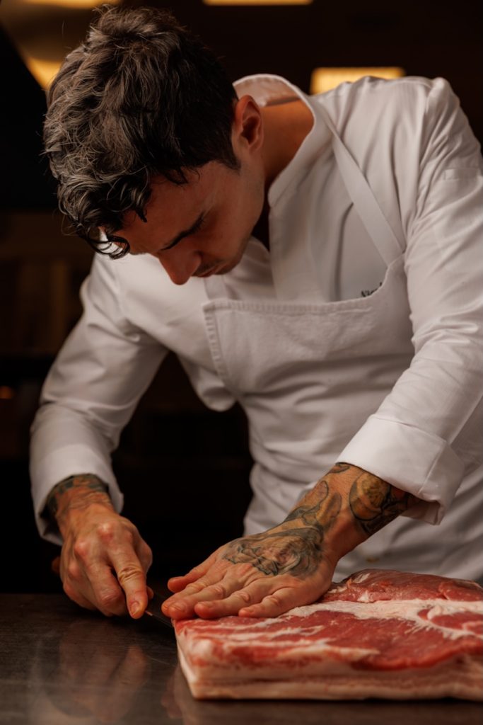 Chef Zamperetti preparing meat