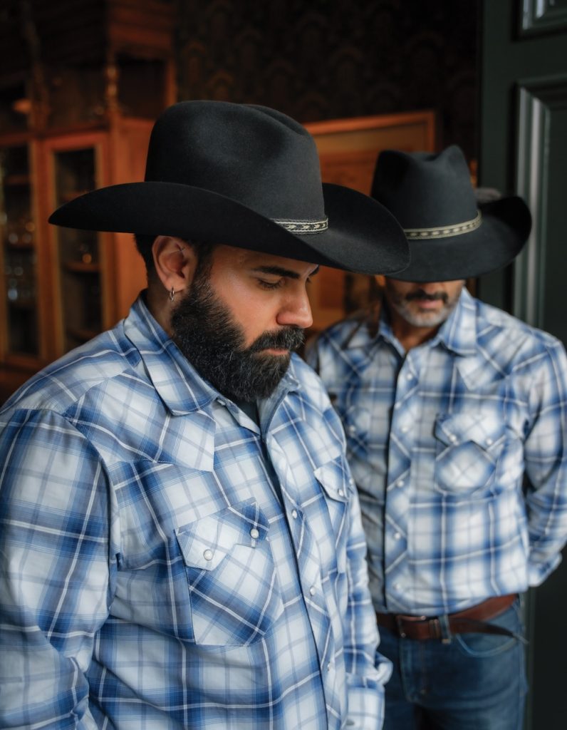 Two men wearing cowboy hats