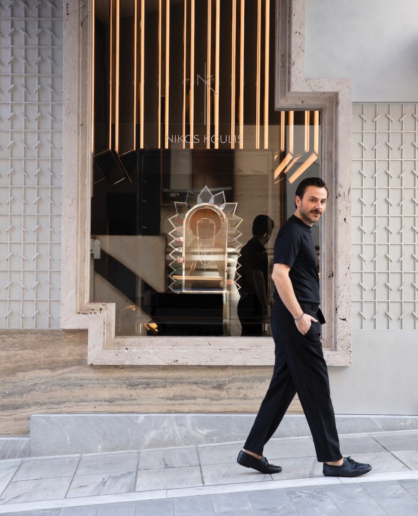 Nikos Koulis walking down street