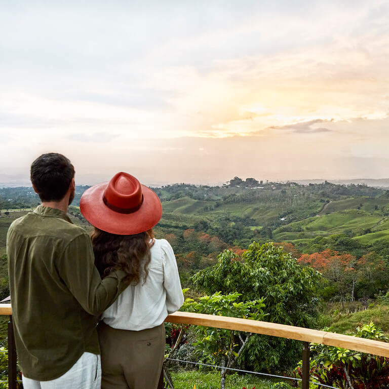 Man and woman overlooking view of the Talamanca Mountains