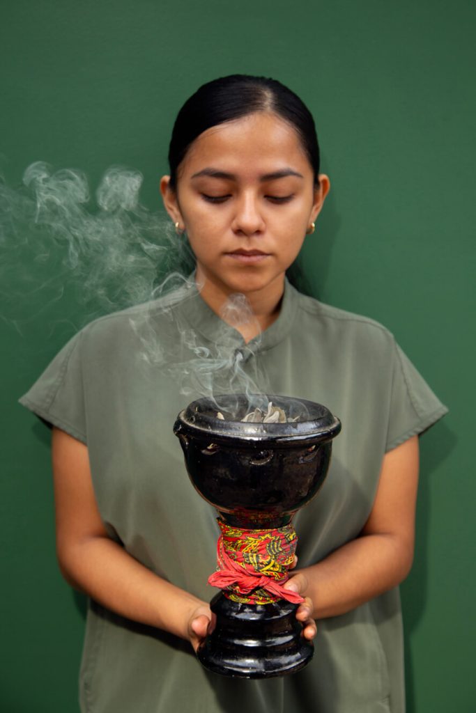 Woman holding ceremonial chalice