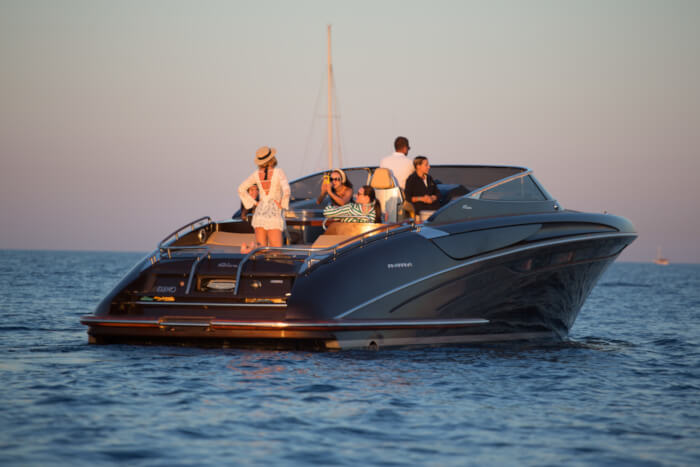 A group of people relaxing on a boat