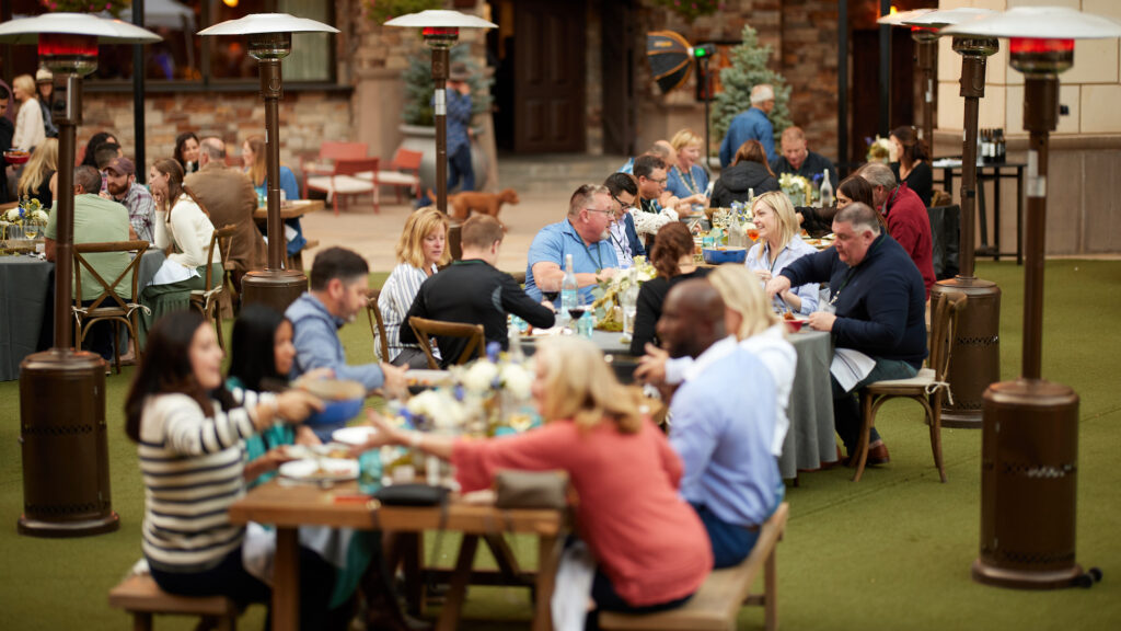 Large outdoor gathering for dinner