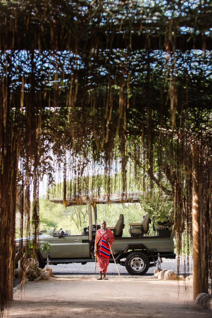 man standing by car